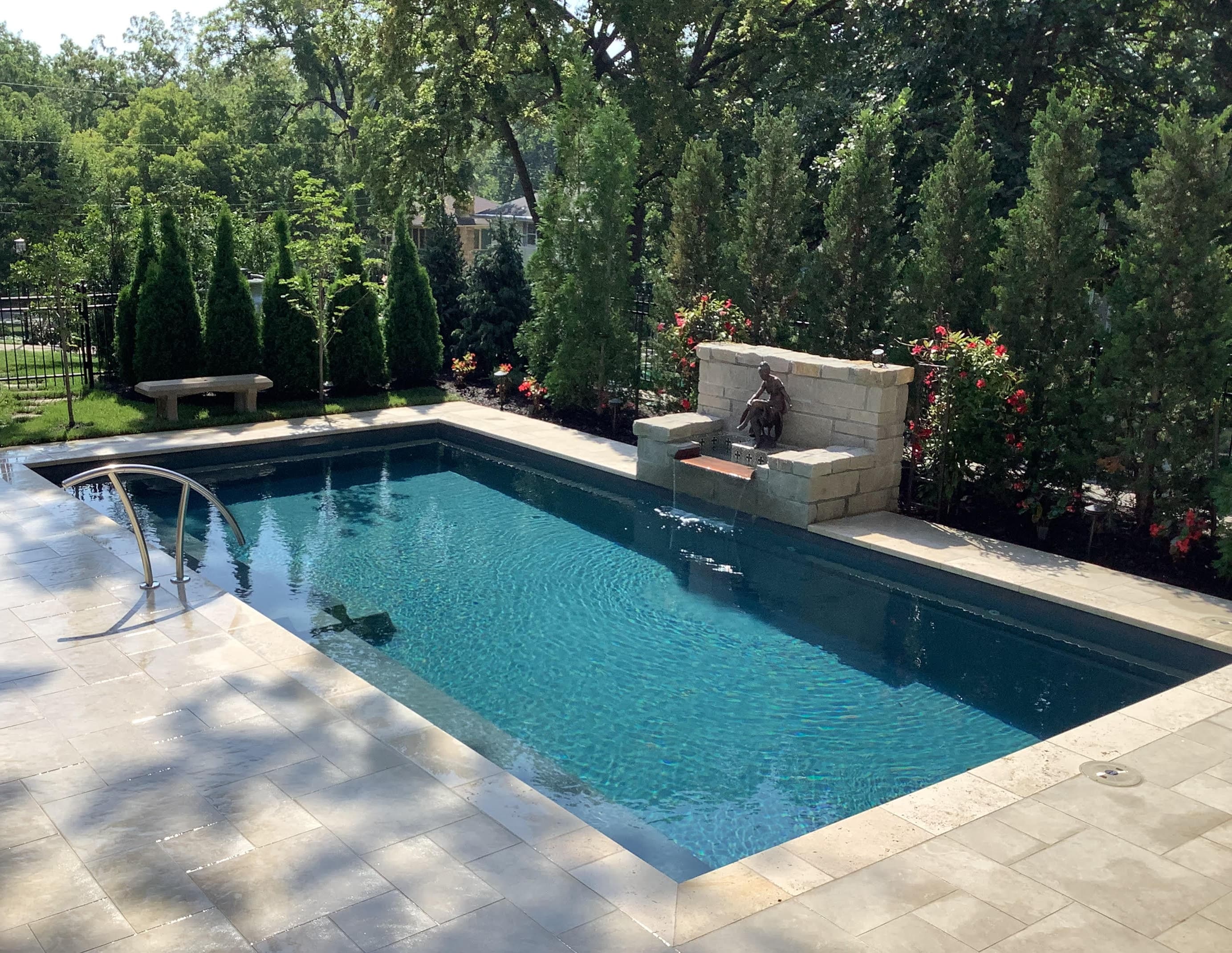 A luxury backyard pool and outdoor living space built by Jaeli Construction